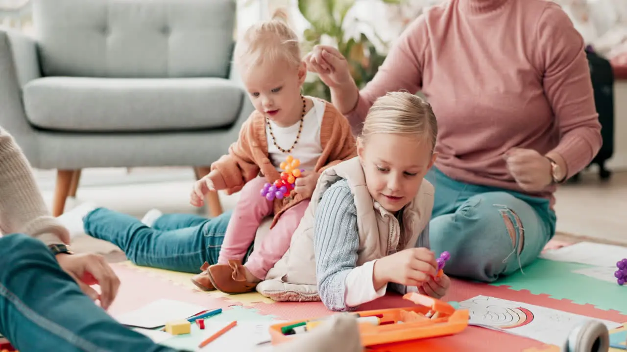 Parents kids and drawing on living room floor