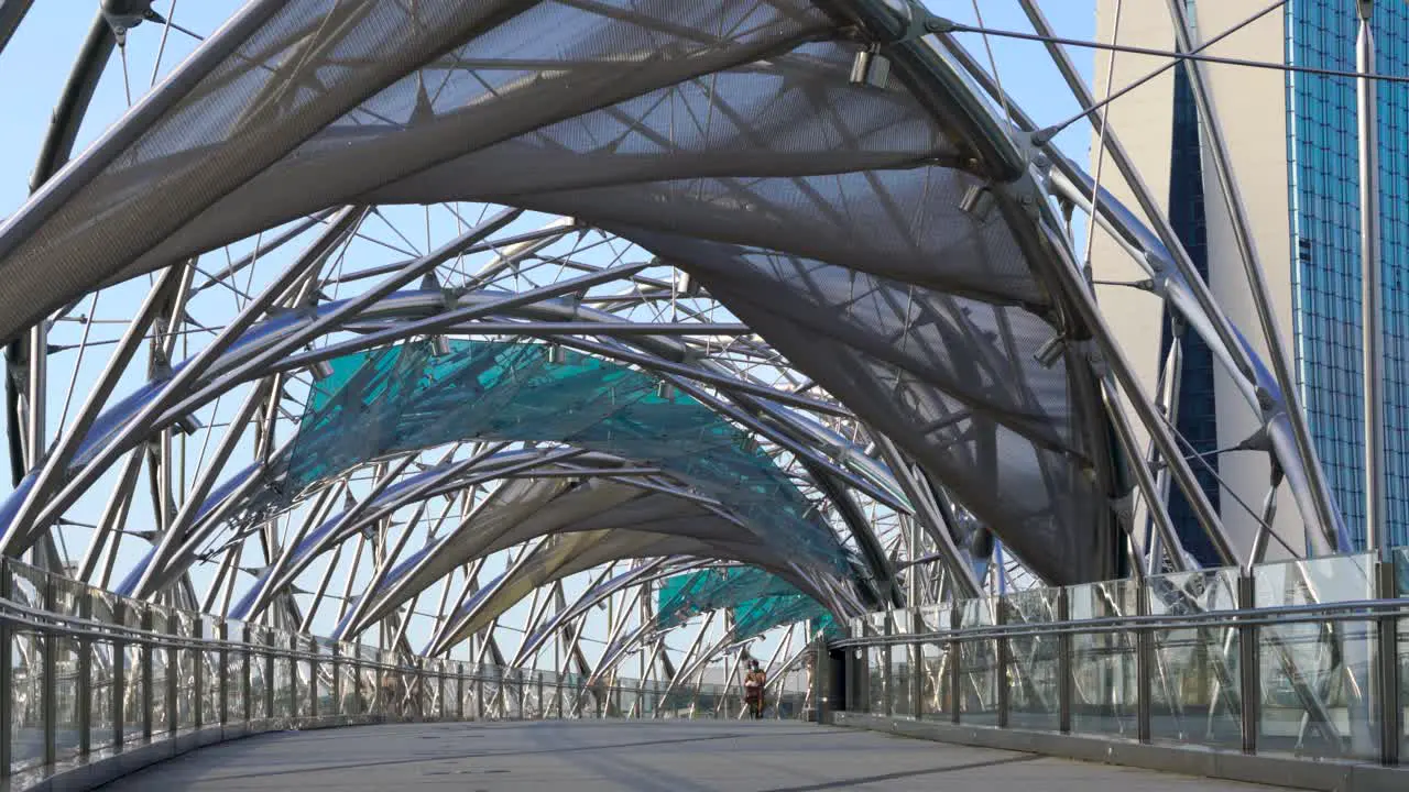 People jogging and cycling early morning at the Helix bridge Marina Bay Singapore