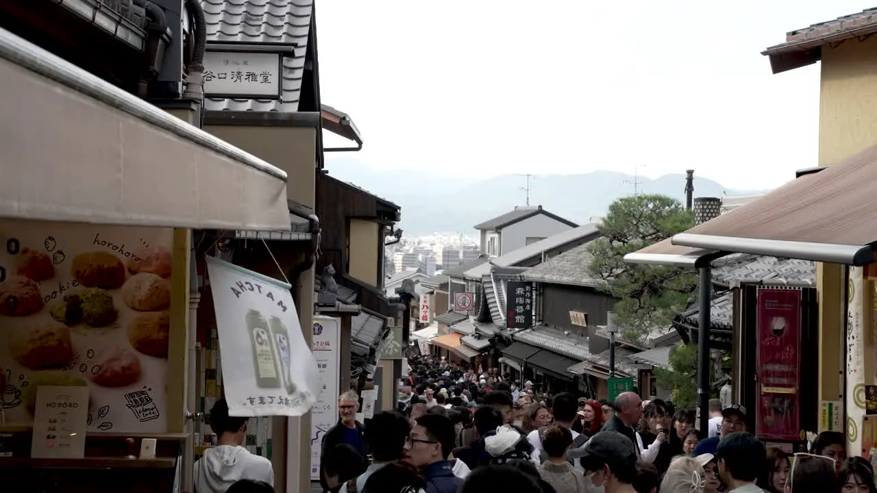 Busy Crowds Along Street Leading To Overtourism At Kiyomizu-dera In Kyoto