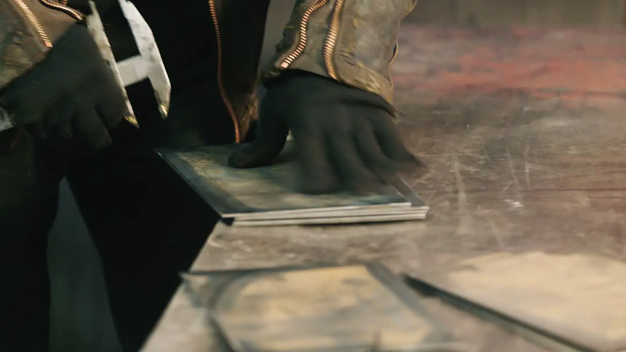 Worker puts a metal workpiece in a machine 2