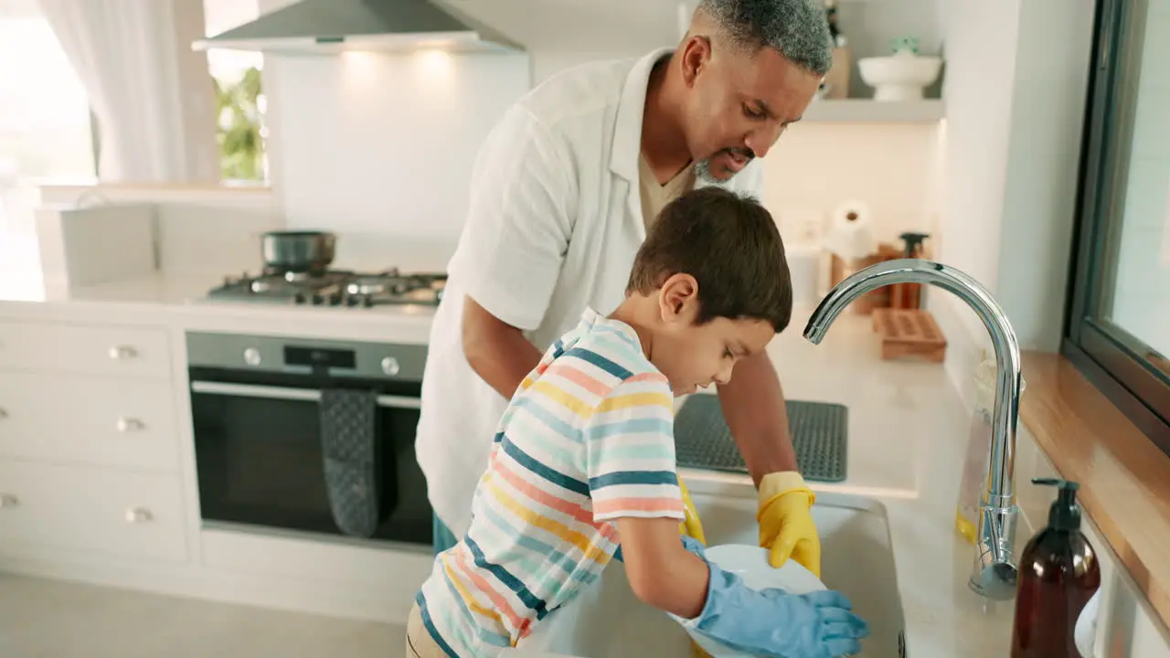 Teaching father or kid washing dishes