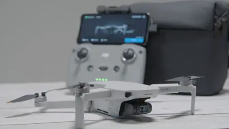 Pull Focus Shot from DJI Mini 2 Drone to Controller Sitting On Table