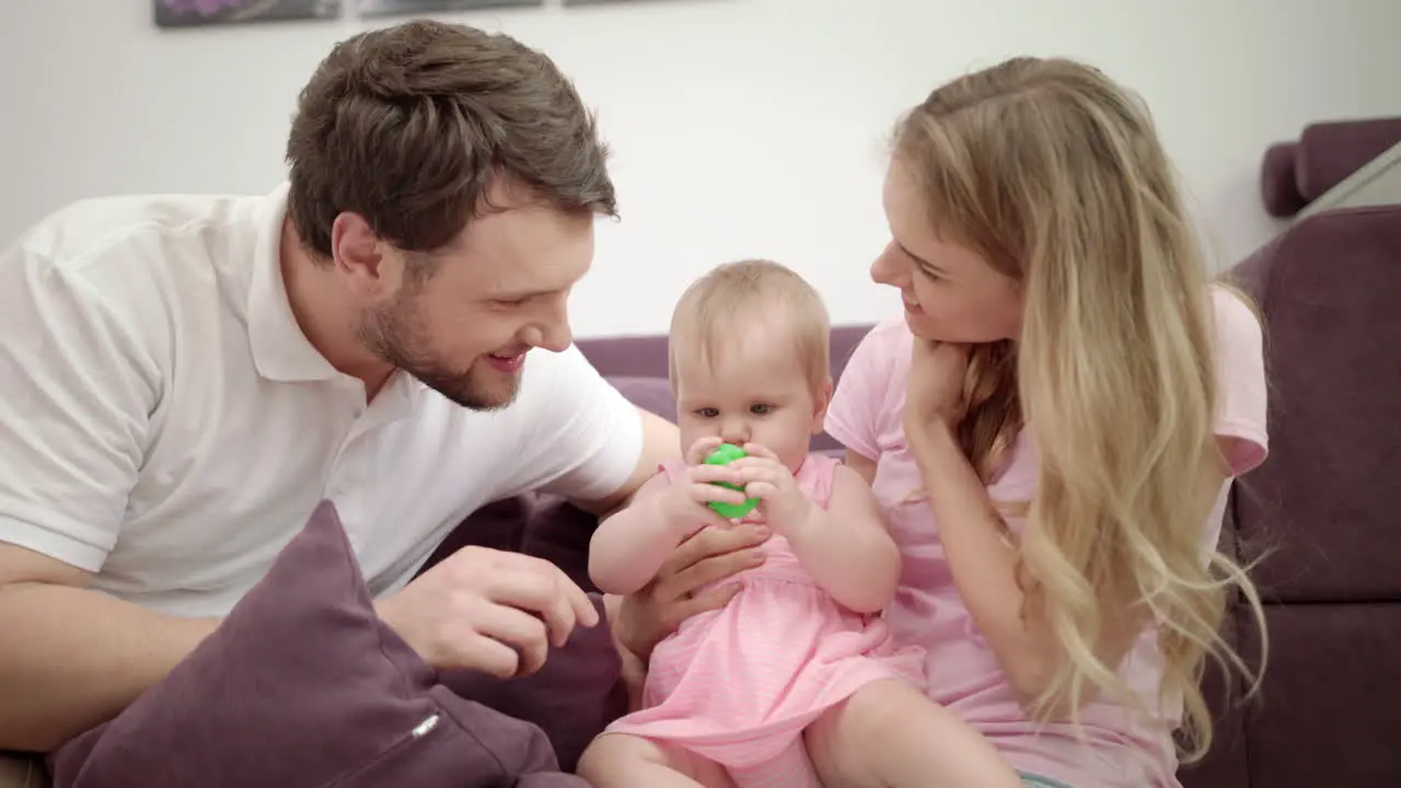 Happy family playing together Joyful family with baby embrace