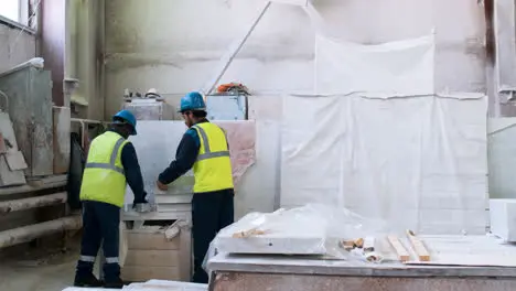 Workmates in a marble factory