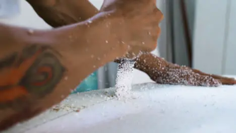 Handheld Close Up Shot of Surfboard Shaper Cutting Into Polystyrene Board