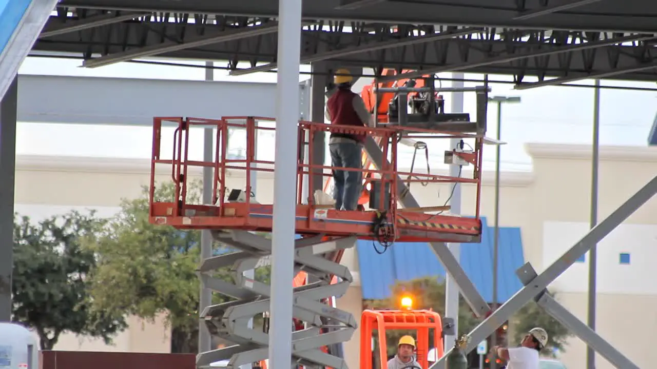 Construction Workers Removing a Beam 2