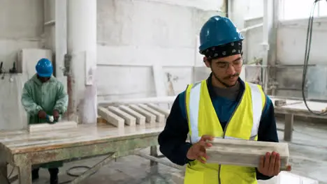 Man examining marble