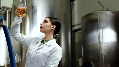 Woman doing control at brewery