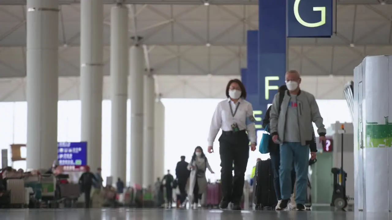 Travel passengers look for airline check-in desks located at the departure hall in Hong Kong's Chek Lap Kok International Airport