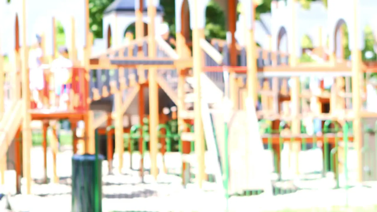 Pan towards brown haired woman having a headache in a park rubbing the sides of her forehead