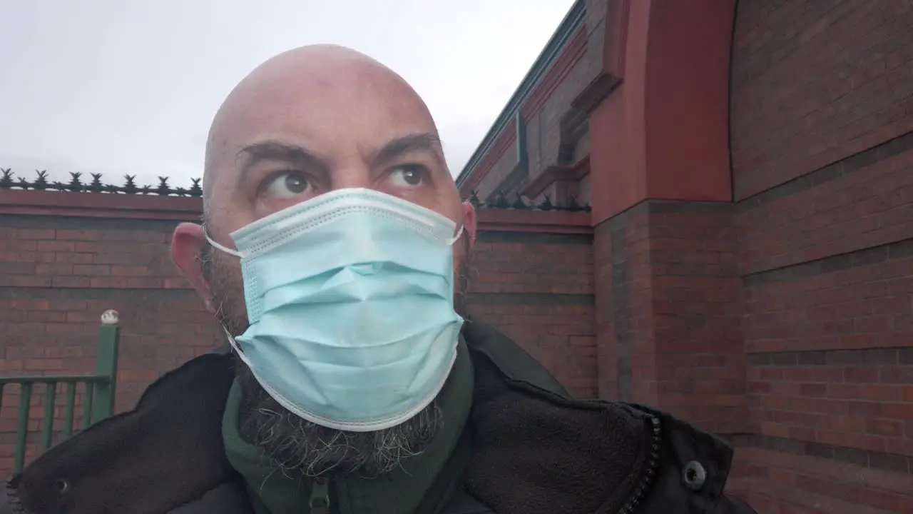 Male security guard wearing protective corona virus medical PPE mask closeup