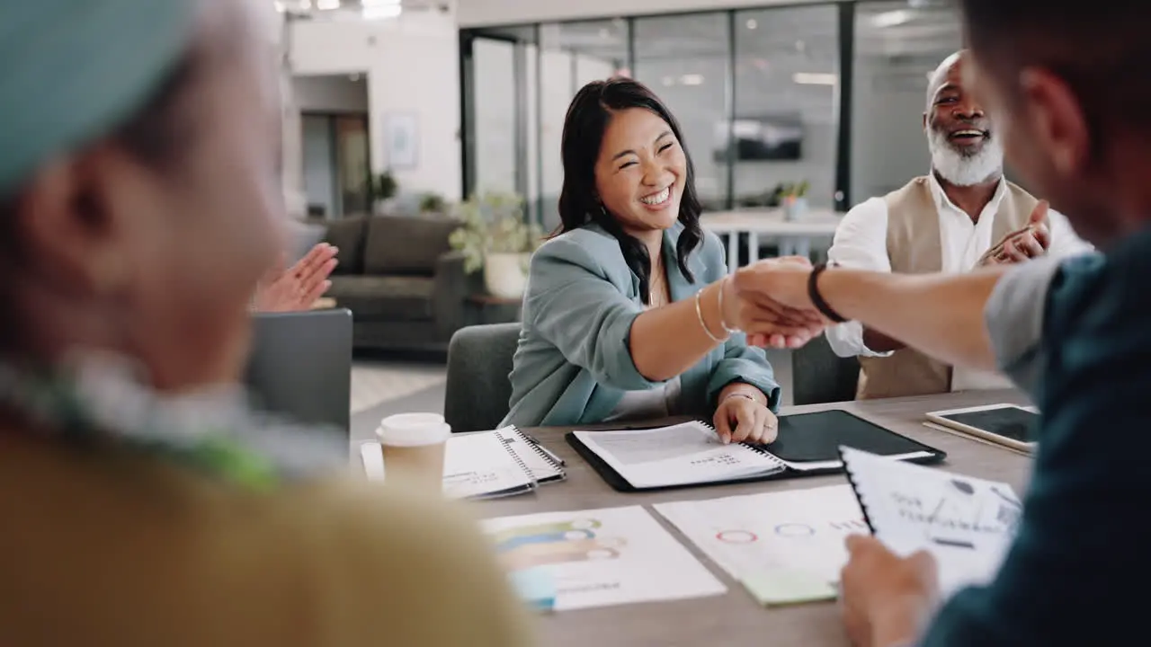 Deal handshake and applause with business people