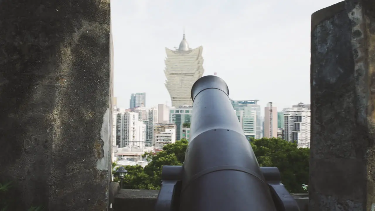 Macau Cannon on the ramparts of the Monte Forte with the Grand Lisboa Hotel in the distance