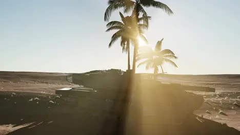 old rusty tank in the desert at sunset