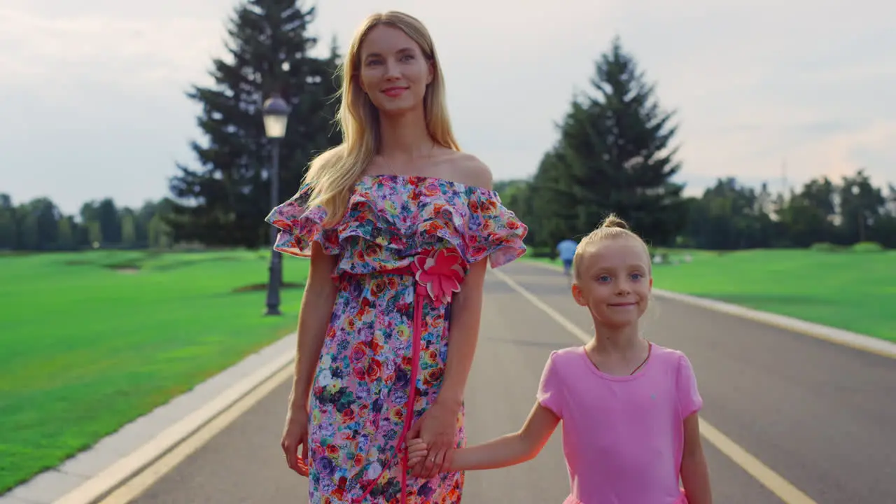 Family walking in garden Mother and daughter spending family weekend outdoor