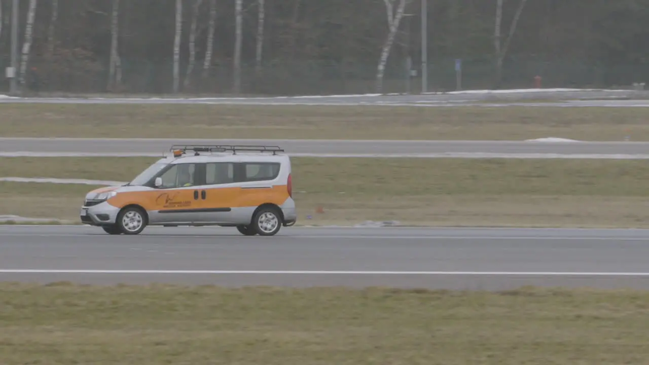 A technical car inspects the runway at Gdansk airport