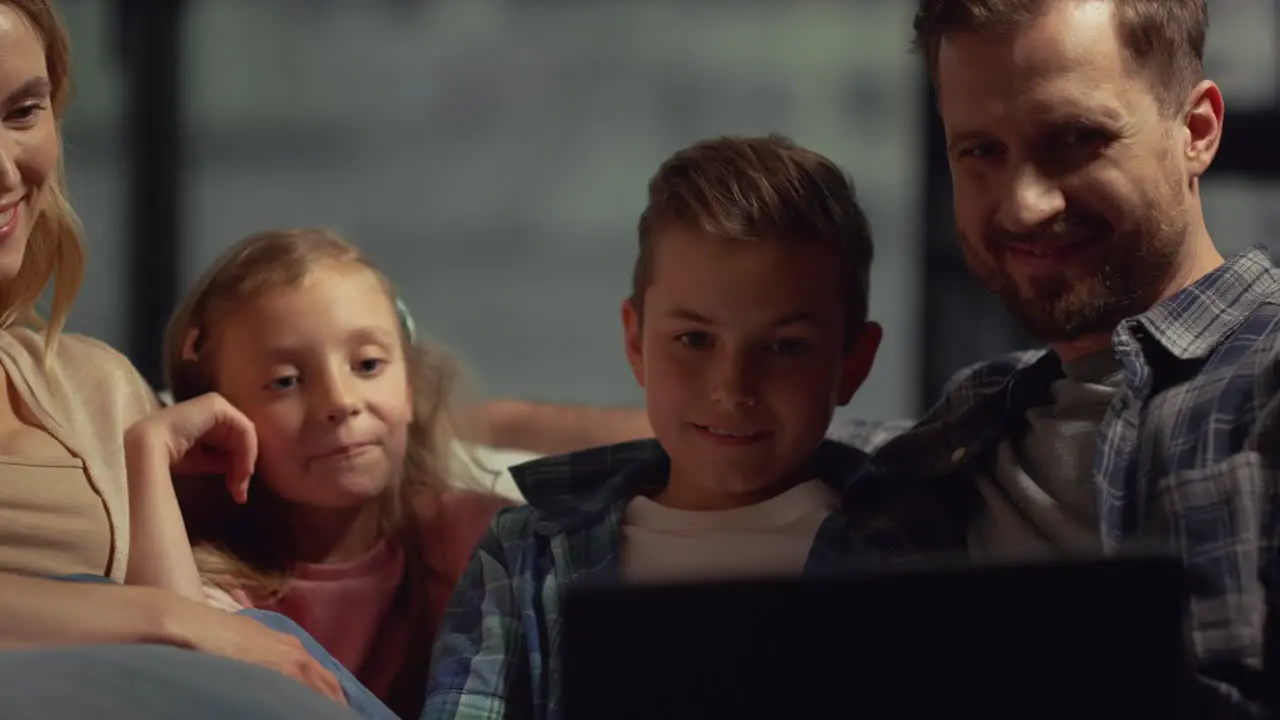 Happy parents and kids having video call on computer Family spending time home