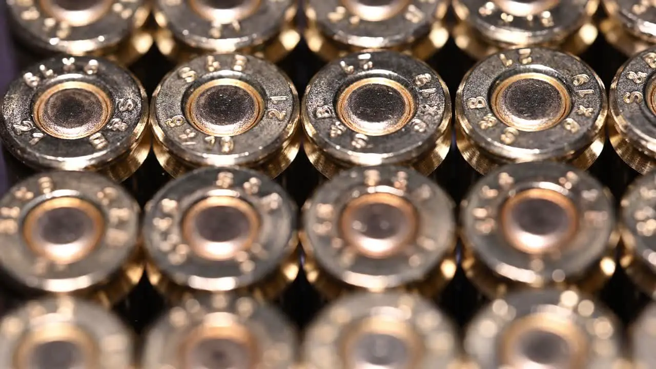 speedy right to left close-up of 9mm ammunition bullets