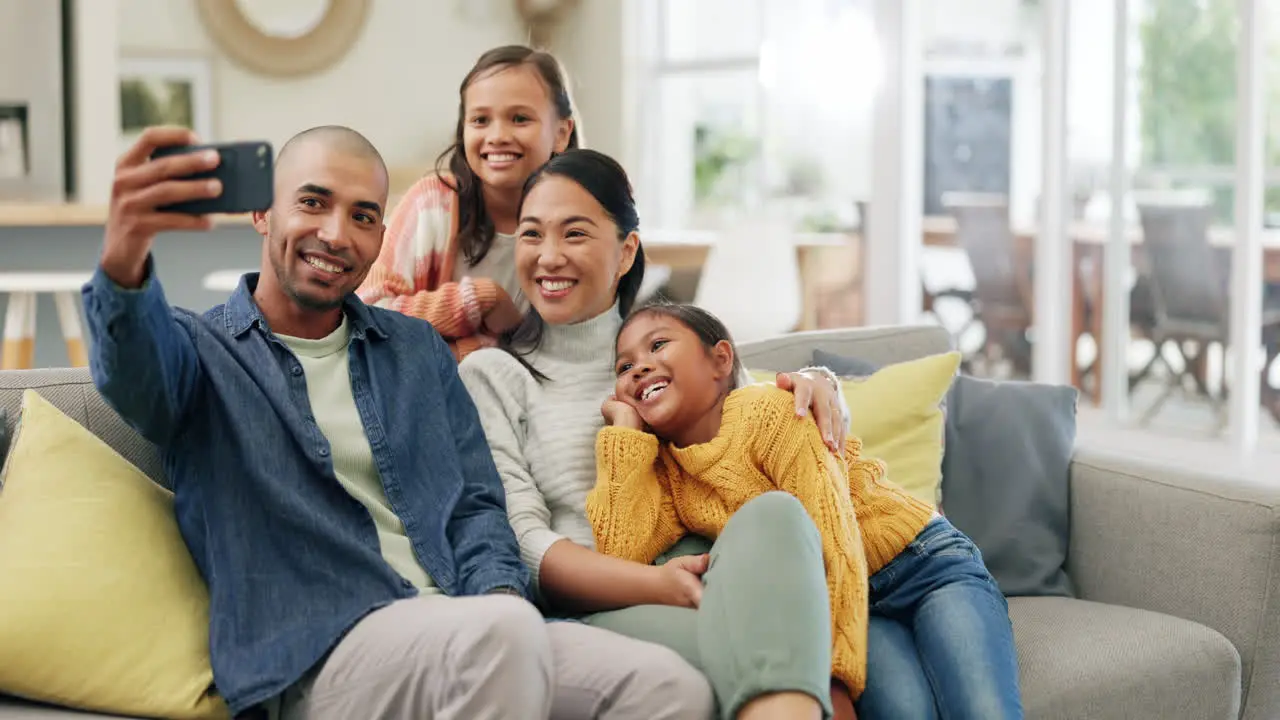 Selfie smile and parents with children on sofa