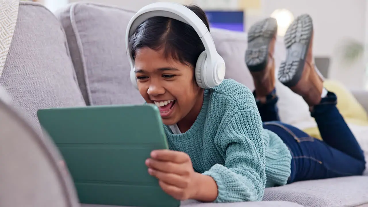 Girl child and tablet headphones