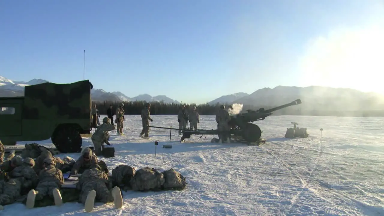 A Piece Of Artillery Is Fired In A Snowy Landscape