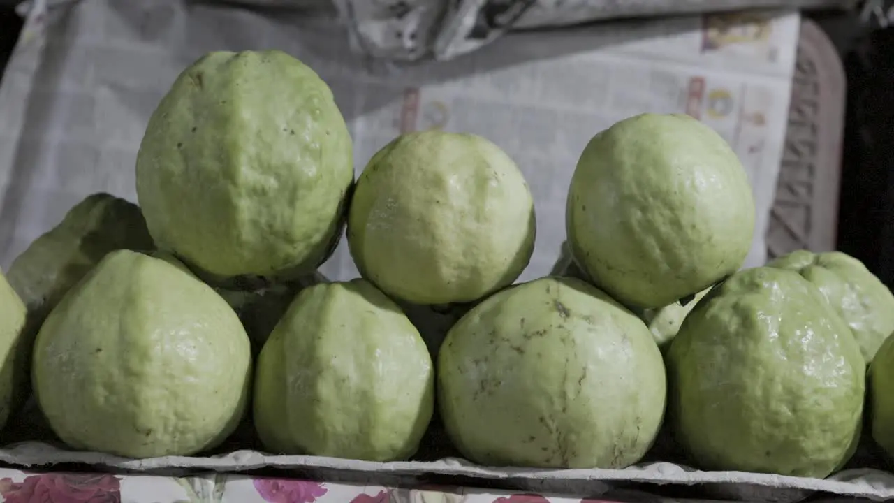 fresh guavas at fruit store for sale at evening