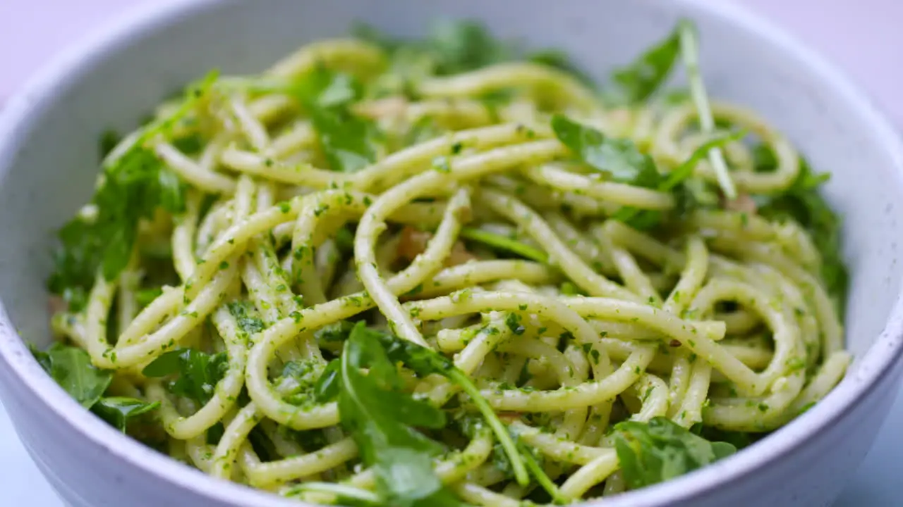 Bowl of spaghetti with pesto and rocket