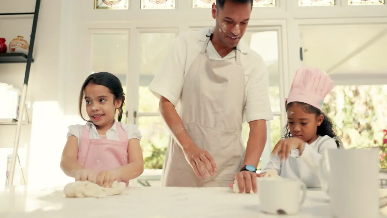 Baking flour and a father teaching his girls