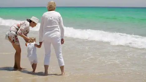 Grandmom Mom and Little Girl Playing at the Beach