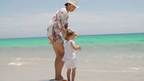 Mom and Daughter Enjoying at the Beach on Summer