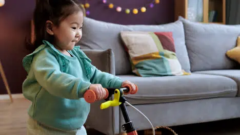 Asian baby riding a bike