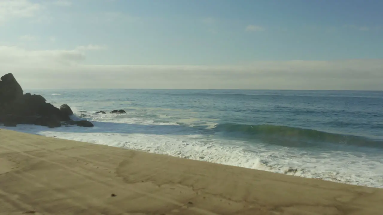  Sea waves crashing against the beachside