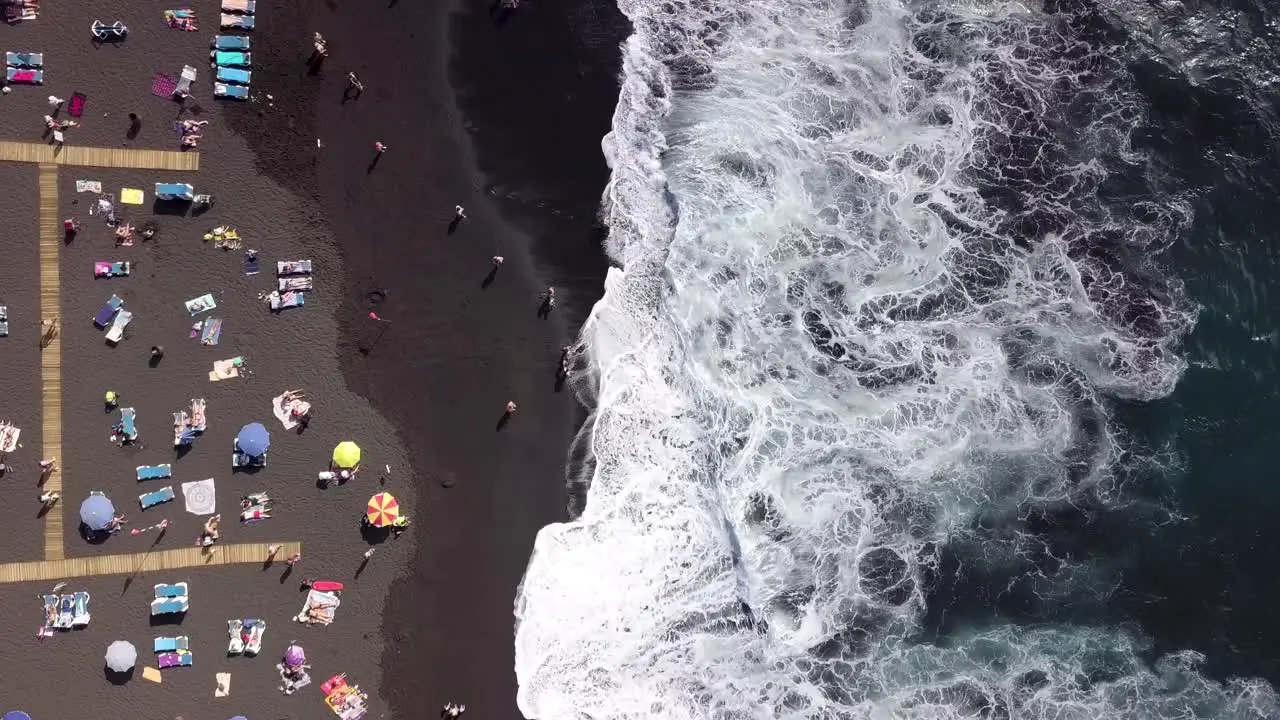 black sand tropical beach aerial top down in playa arena Tenerife island spain