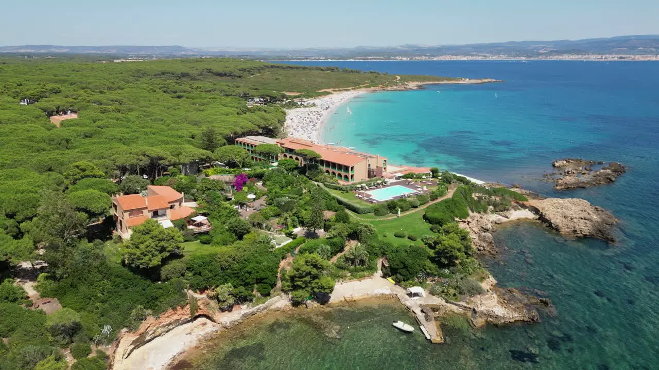 Luxury beach hotel resort at Cala Spinosa Beach Sardinia Italy 4k Aerial