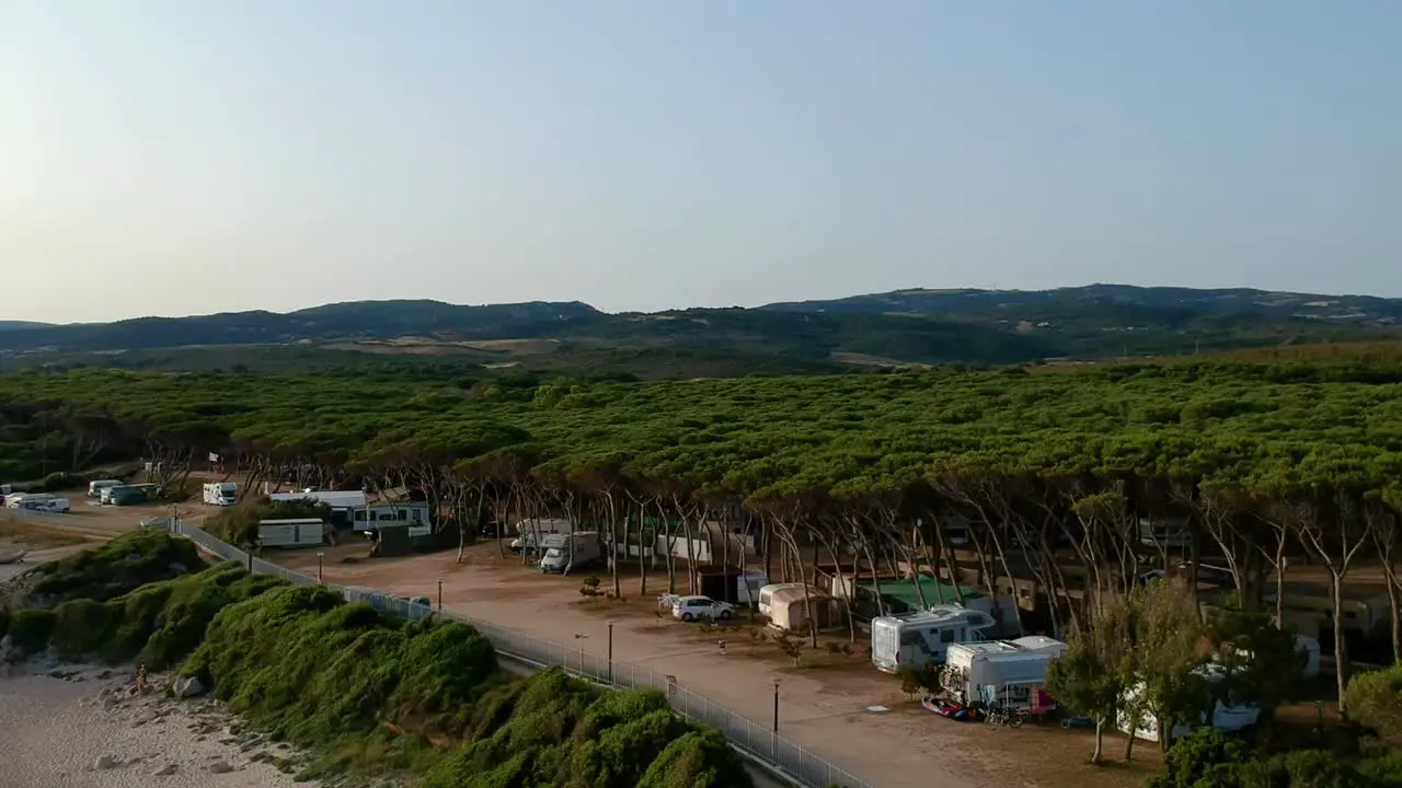 campsite with campers in Italy Sardaigne enjoying the summer aerial shot