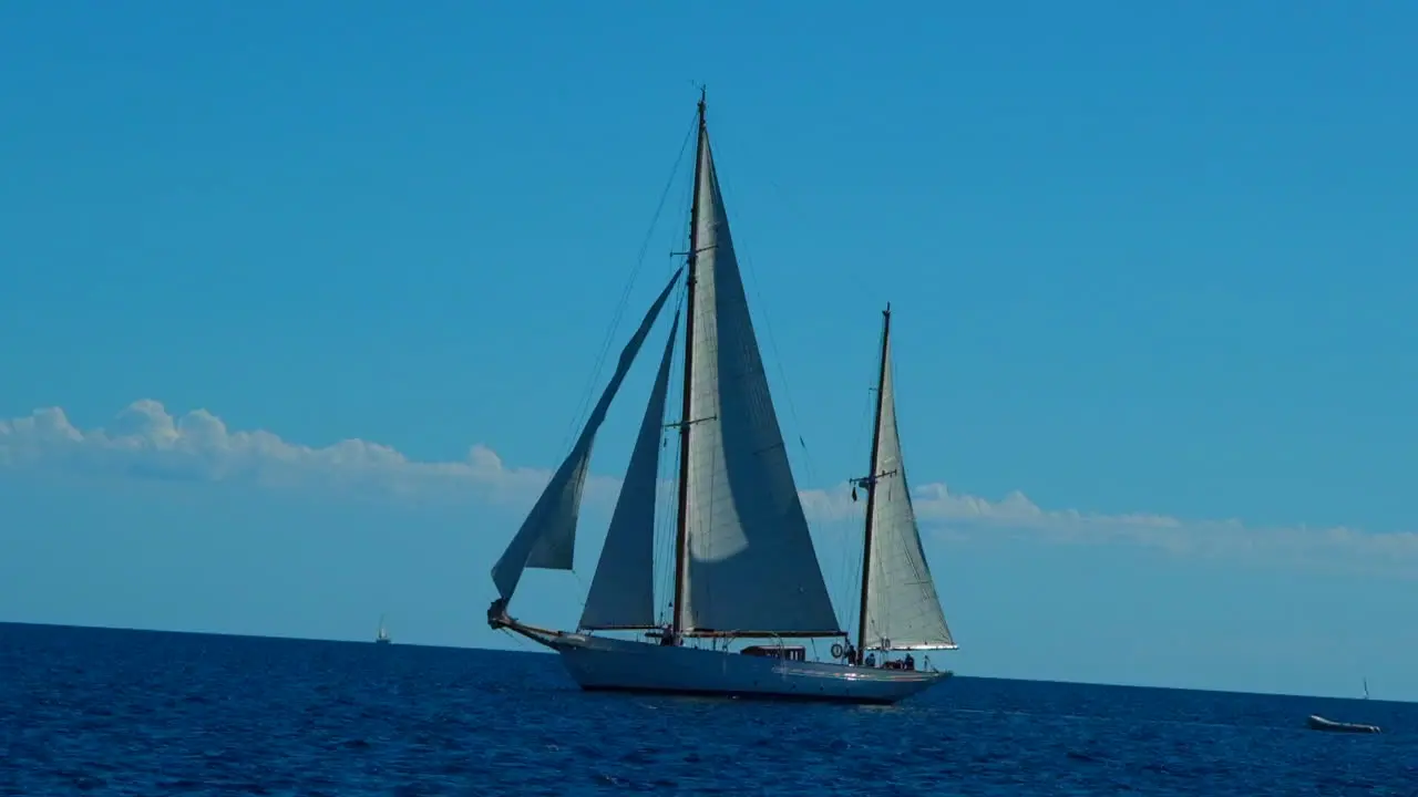 Beautiful sailing boat sails in the Adriatic sea on a bright blue calm sunny day