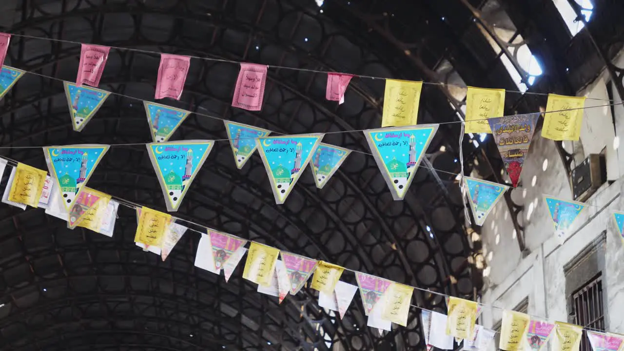 Colorful fiesta flag banners hanging above the hatchway in Damaskus syria