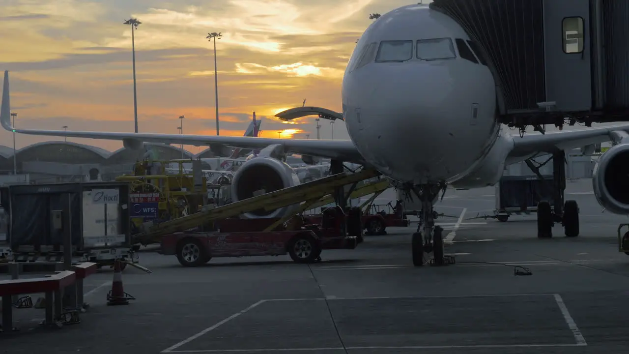 Timelapse of loading airplane at sunset