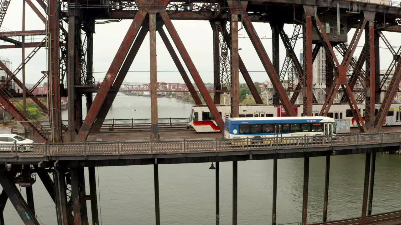 Circling aerial shot over a Max Tram on Steel Bridge Portland Oregon