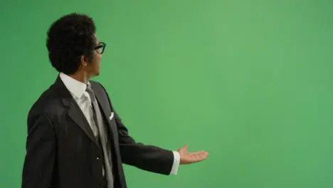 Businessman gesturing with arms on green screen