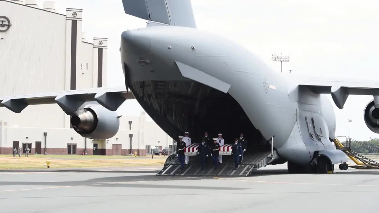 Flag Draped Coffins Of Dead Us Soldiers Being Returned Home Are Displayed In A Military Hangar