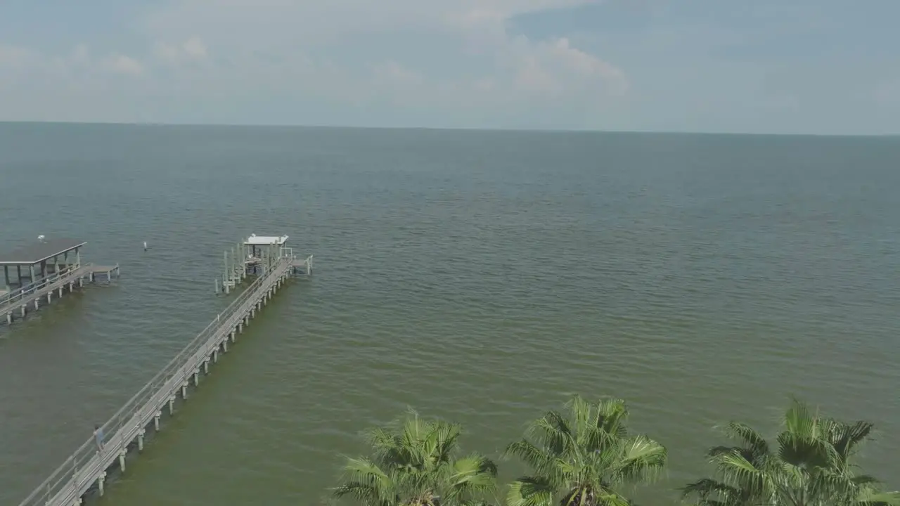 An aerial view of the City of Kemah lighthouse on a sunny day with white clouds in Kemah Texas