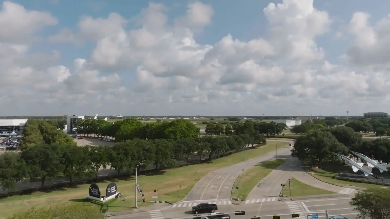 Aerial drone view panning right to left of the entrance to Space Center Houston on NASA road 1 in Houston Texas