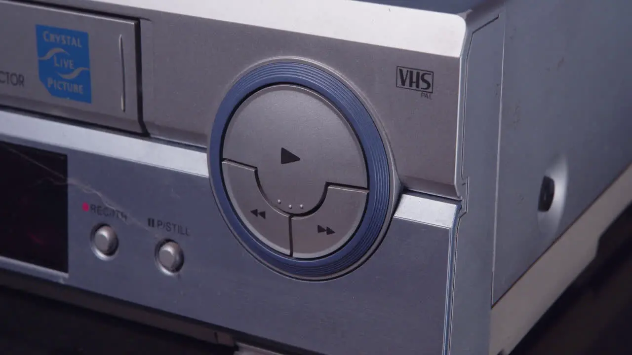 Insert a VHS tape into the VCR and press the play button