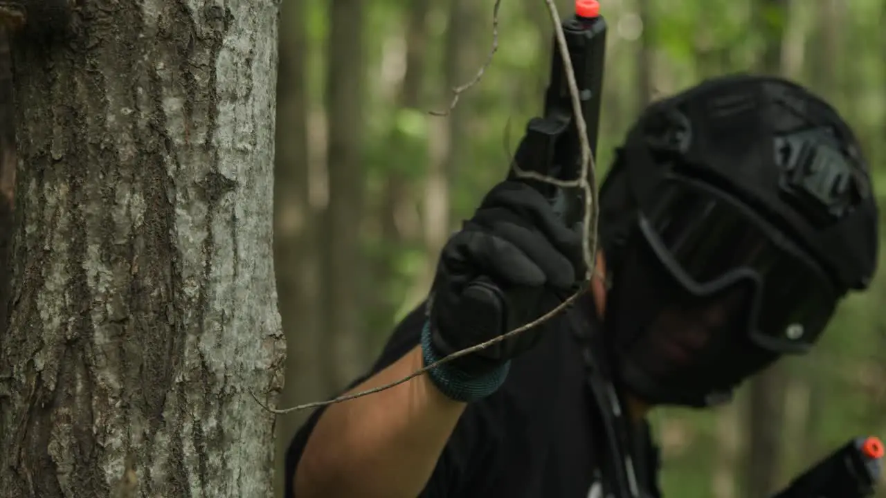 Tactical army guy looks down and pull out