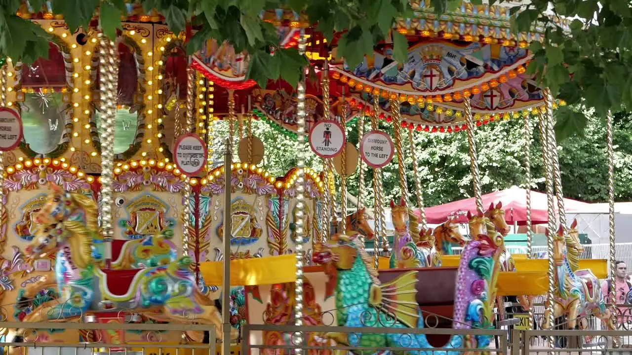 Funfair carrousel spins in daylight