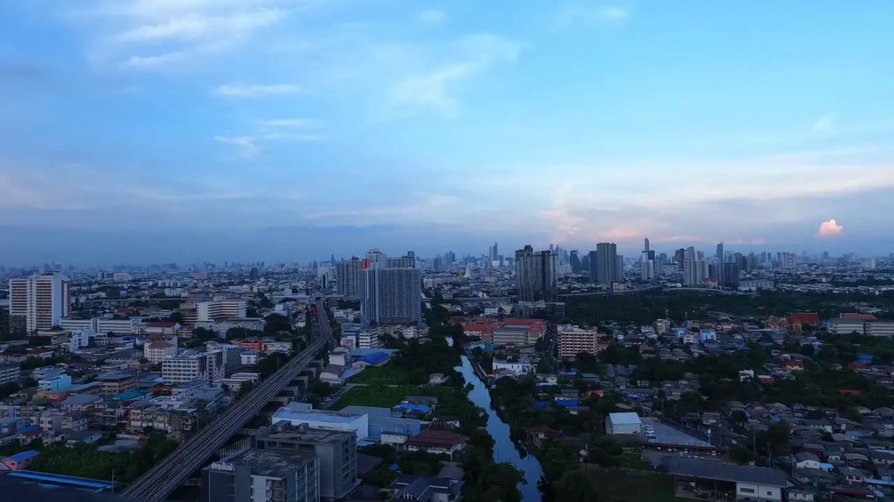 Day to night lapse Bangkok with the skyline and lights cars trains 4k video