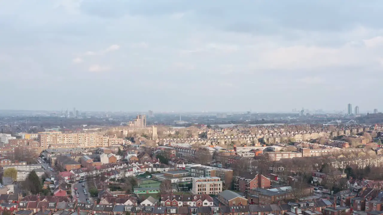 Dolly forward drone shot over suburban north London near alexandra palace