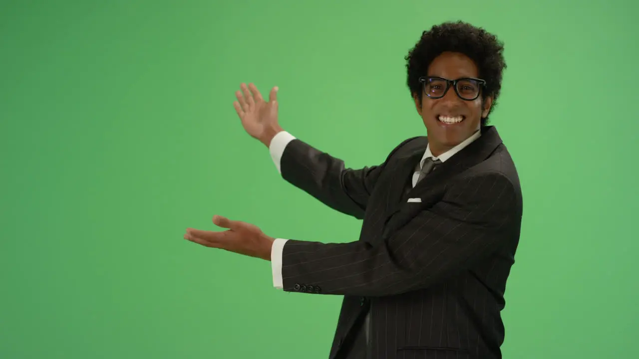 Happy Businessman gesturing with arms on green screen