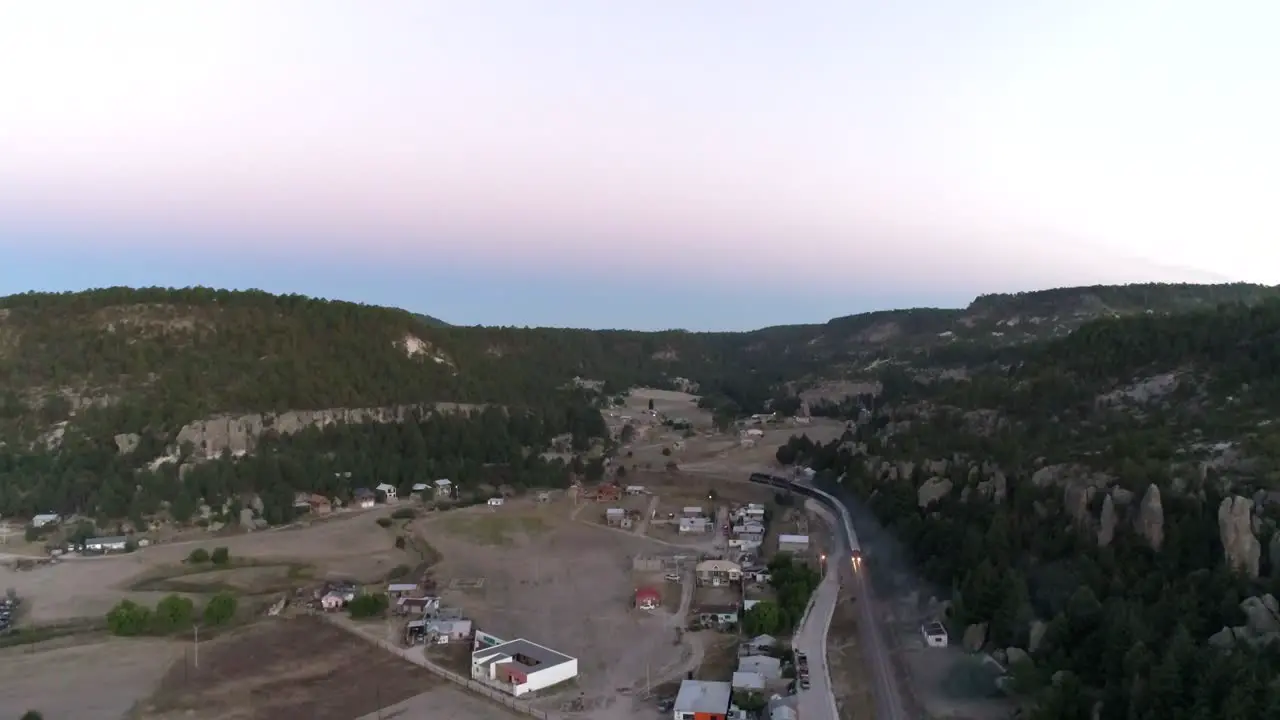 Aerial wide shot of the El Chepe passenger train in Creel Chihuahua Mexico